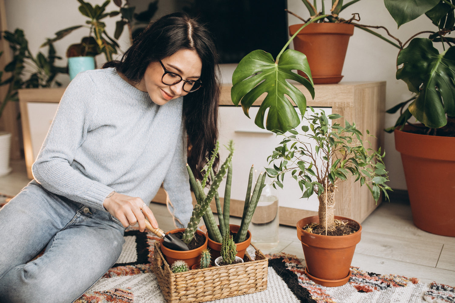 young women cultivating plant